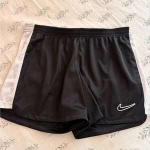 Nike Women’s Black Athletic Shorts with White Panels and Swoosh